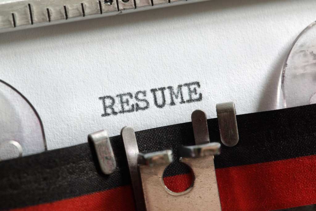 Resume vitae written on an old typewriter concept for job search and recruitment