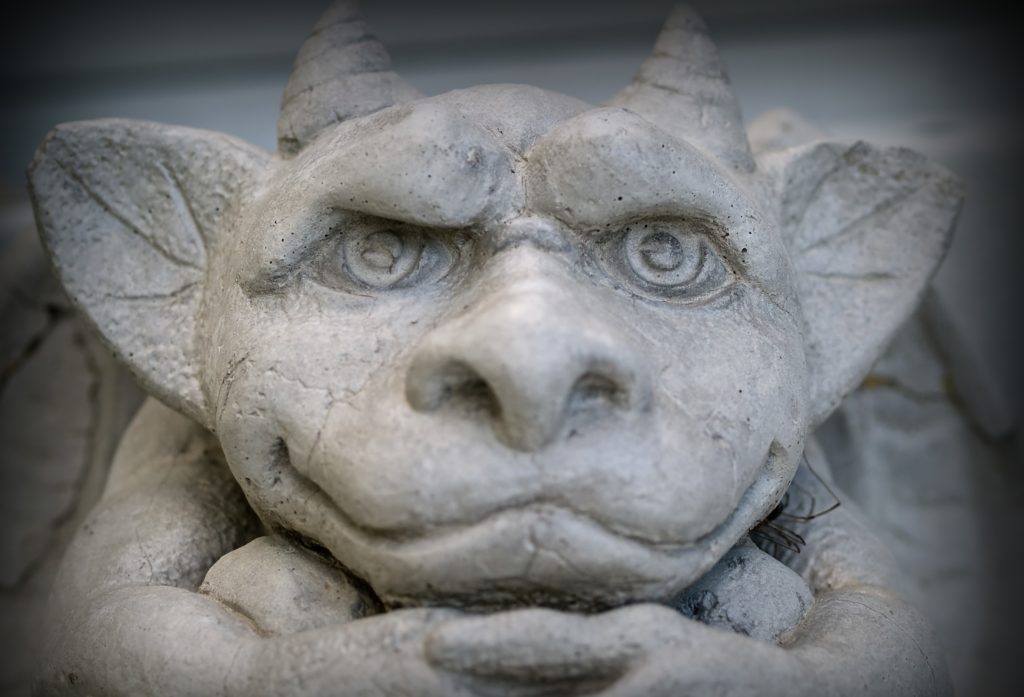 Gargoyle Statue Emphasis on Face and Eyes with a Dark Border